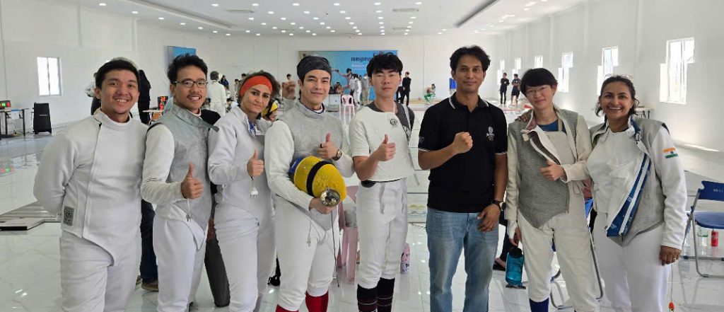 Michael is the 4th person from the right.